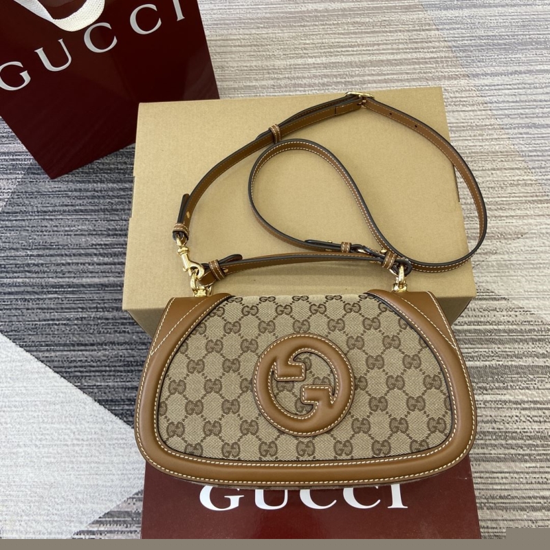 G*u*i top handle bags